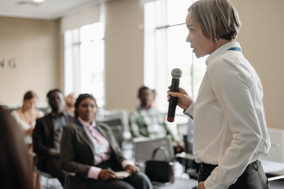 woman giving presentation to group